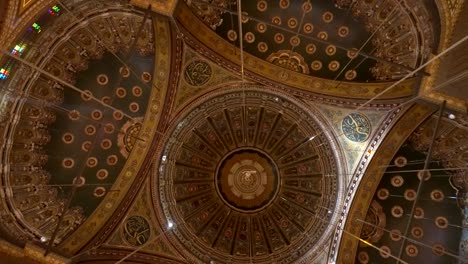 mosque of muhammad ali interior illuminated chandelier ceiling with painting of arab muslim in arch