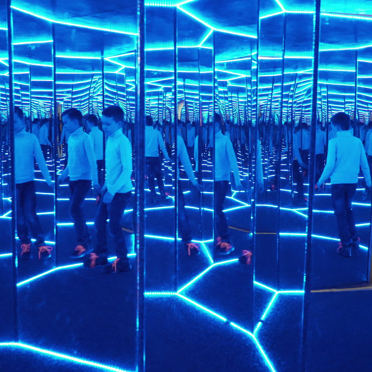 Boy playing with distorted mirror. Museum of entertaining sciences Square video