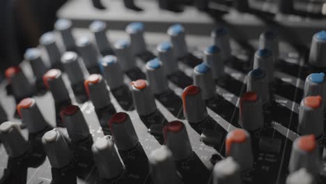 Knobs-of-music-mixing-system,-change-lights-and-shadow,-close-up-view