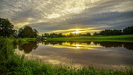 Sunrise-mirage,-timelapse-of-sky-and-clouds-reflections-on-the-lake