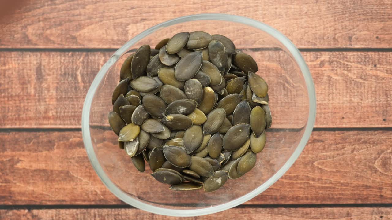 Pumpkin Seeds in a Glass Bowl