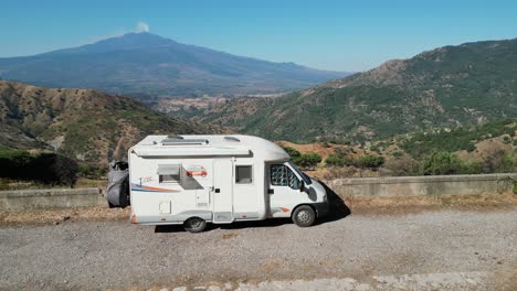 rv motorhome enjoys panoramic mount etna volcano view in sicily, italy - aerial 4k