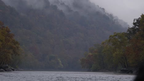 Static-shot-of-the-stunning-river-Gorge-with-a-hiker-walking-past