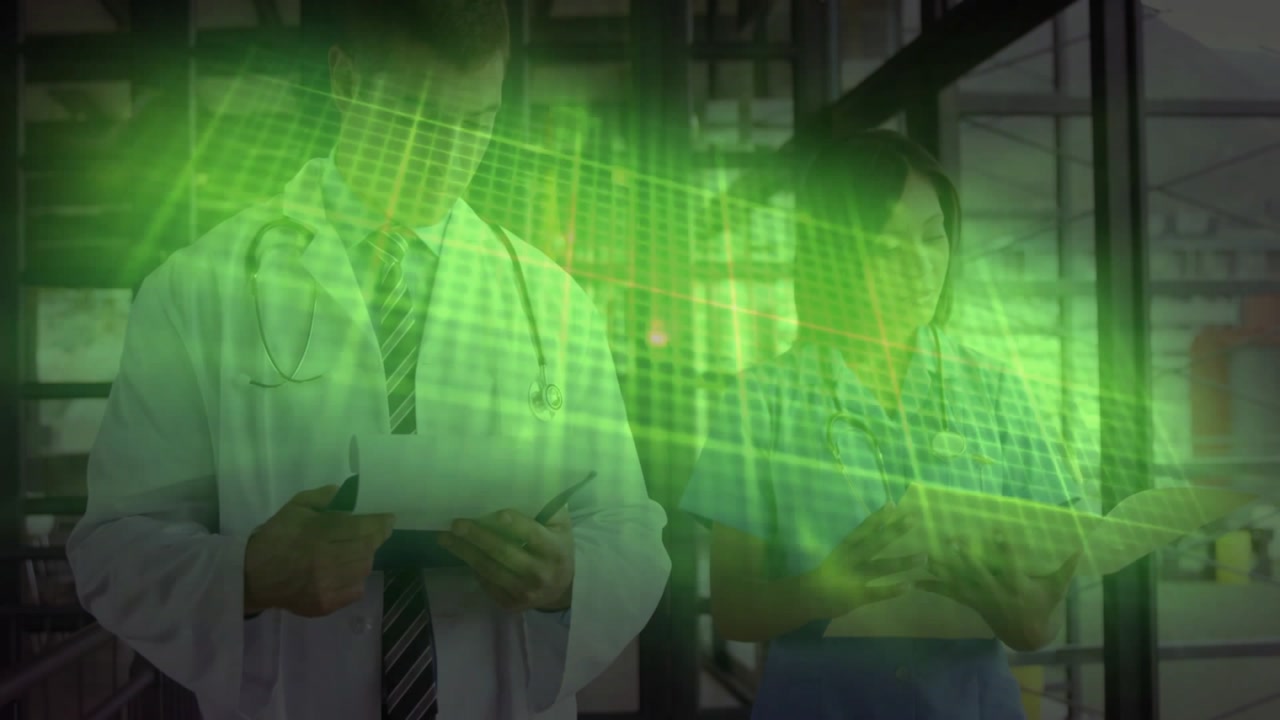 Doctor and nurse reviewing chart in clinic, tapping tablet initiating transparent grid pulsing