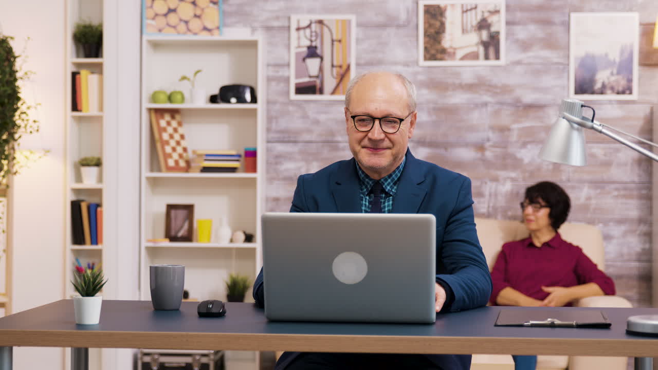 Man working on laptop in home office