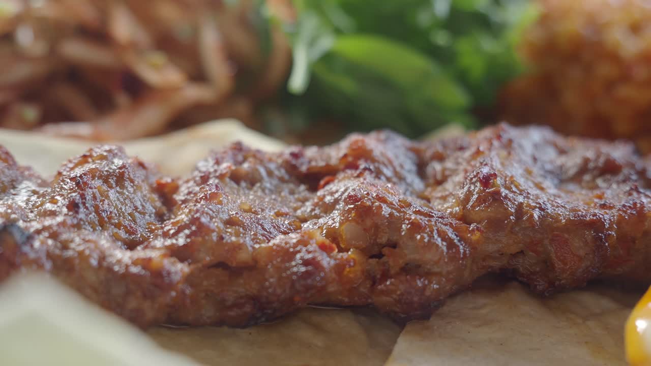 Delicious Adana Kebab with Salad and Vegetables