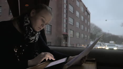 busy businesswoman traveling by train and doing her job