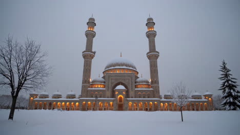 snowy mosque at night