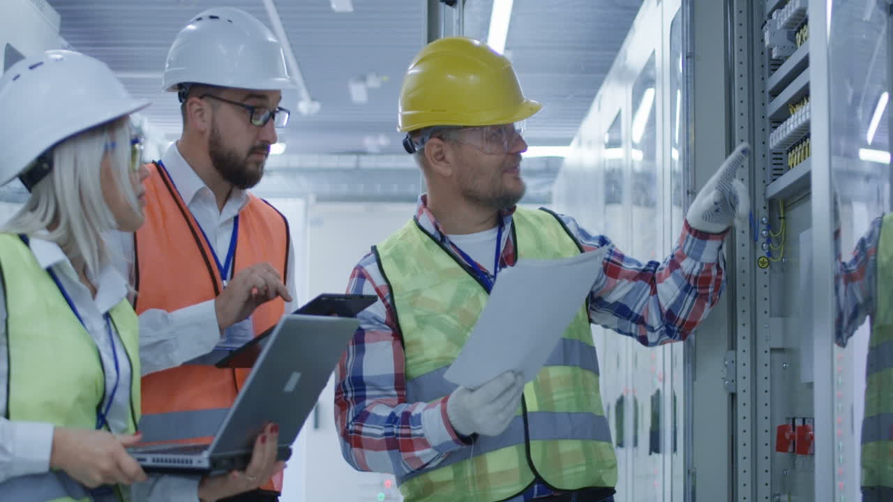 Electricians Inspecting Electrical Panel