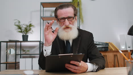 business man working on laptop at office talk on online communication video call with employee, boss