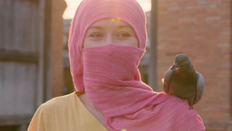 woman with pigeon on shoulder