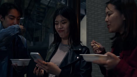 friends enjoying street food at night