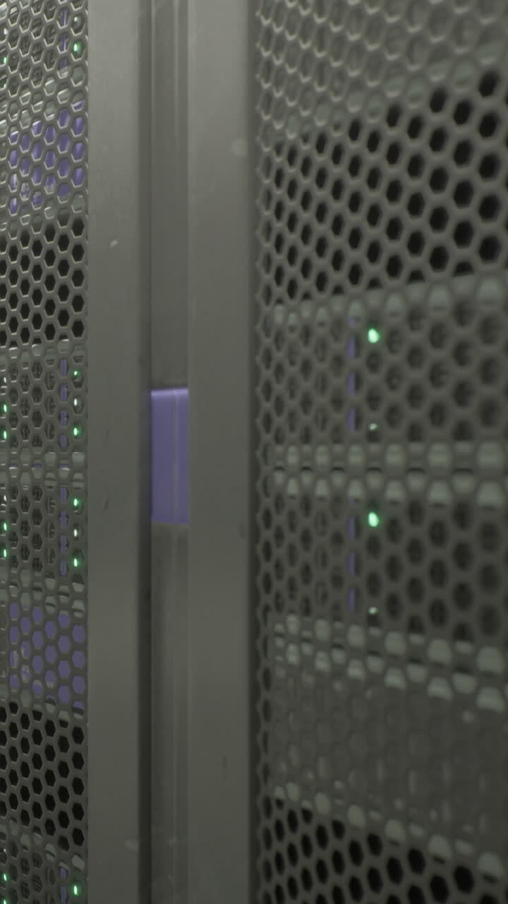 Two rows of server units are seen with green lights indicating operation