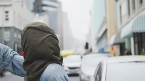 woman wearing hijab looking for a taxi