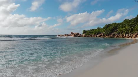 Aerial-view-of-the-white-beaches-and-turquoise-waters-at-Anse-Coco,-Petit-Anse-and-Grand-Anse-on-La-Digue,-an-island-of-the-Seychelles