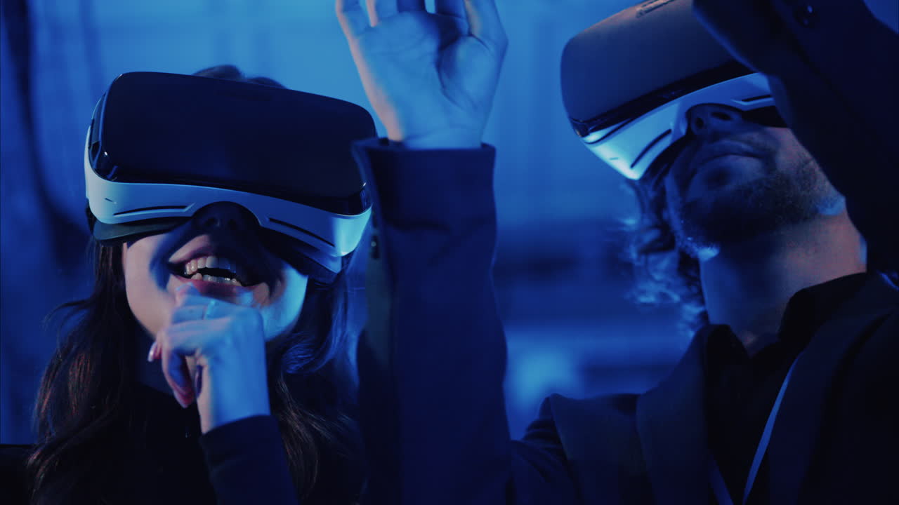 A man and a woman using Virtual Reality headsets in a server room