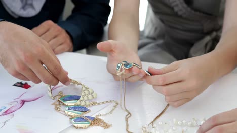 design team looking at costume jewelry