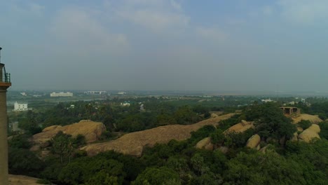 Light-house-of-mamallapuram-situated-among-famous-Rock-cut-Pallava-era-temples,-aerial-view-shot-on-Phantom-4-pro-4K-drone