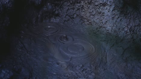 Boiling-hot-geothermal-volcanic-mud-pool,-closeup-shot-steamy-lake-bubbling-mud-and-steam-satisfying