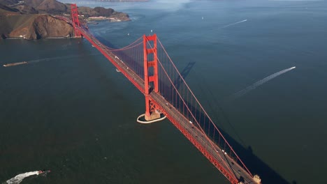 aerial view above the old iconic golden gate bridge, in sunny san francisco, usa - high angle, tilt, drone shot