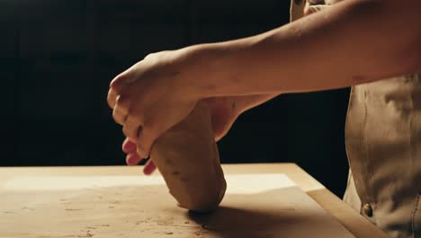 hands shaping clay