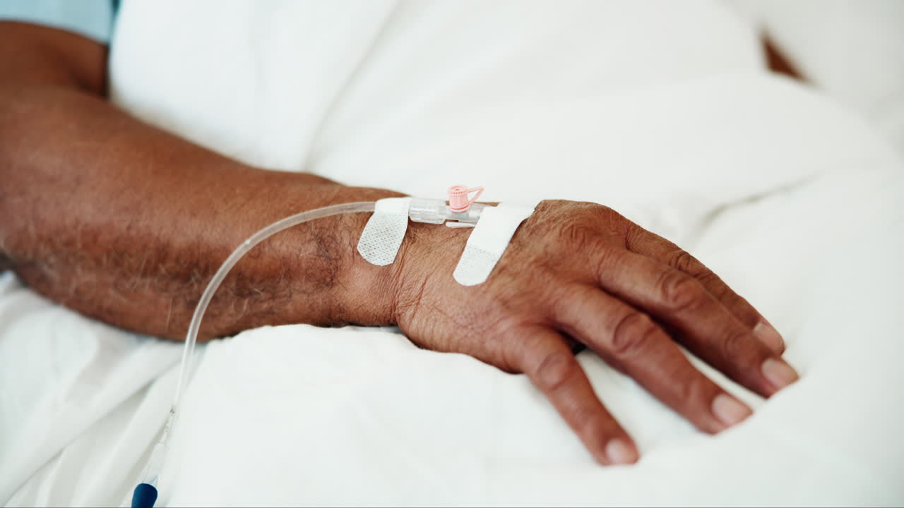 Hand of a patient receiving intravenous therapy