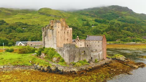 Close-Up-Aerial-Pan-of-Eilean-Donan-Castle-in-the-Scottish-Highlands,-Scotland,-United-Kingdom