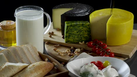 selection of cheeses, bread, and other dairy products