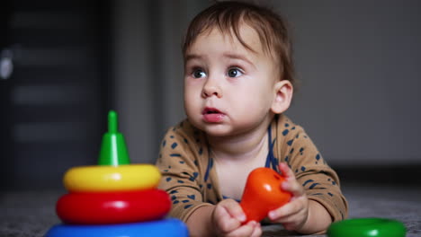 baby playing with stacking rings