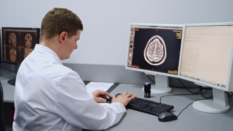 doctor reviewing medical images on computer