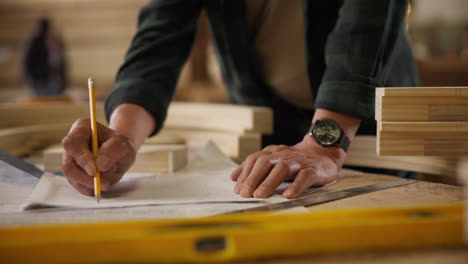 carpenter drawing blueprint