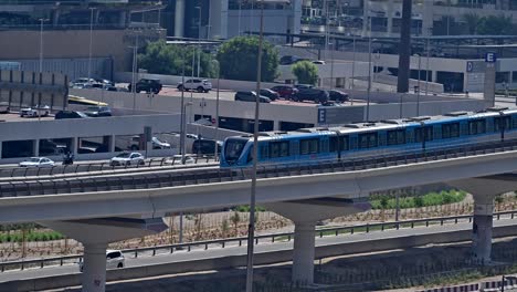 a dubai metro train heads to its next stop along sheikh zayed road in dubai, uae