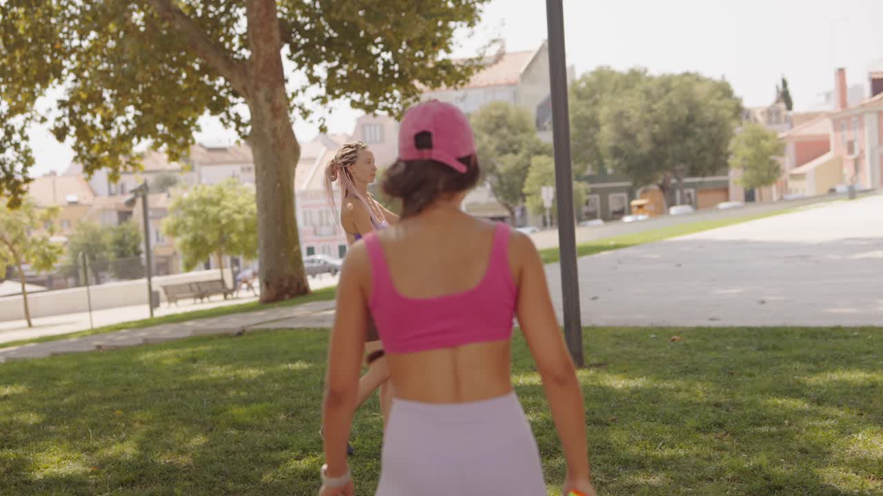 Women playing sports in the park
