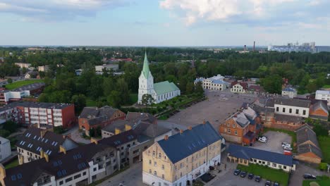 aerial panorama of dobele town center and evangelical lutheran church at summer scenic drone view in golden hour light over dobeles historic center on a warm summer evening peaceful latvian town