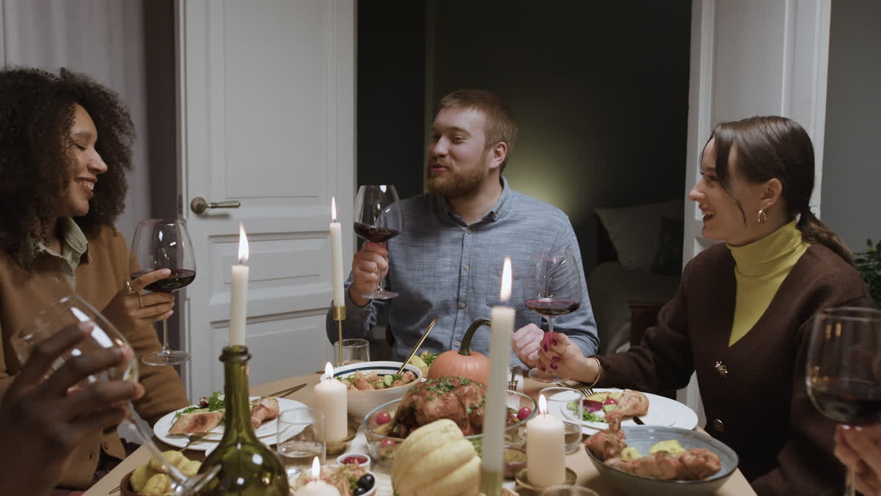 Friends enjoying a dinner party with wine and laughter