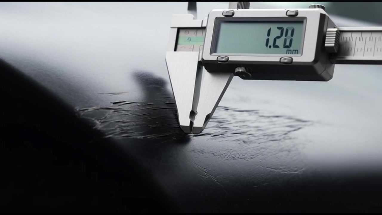 Digital Caliper Measuring Scratches on a Car Surface