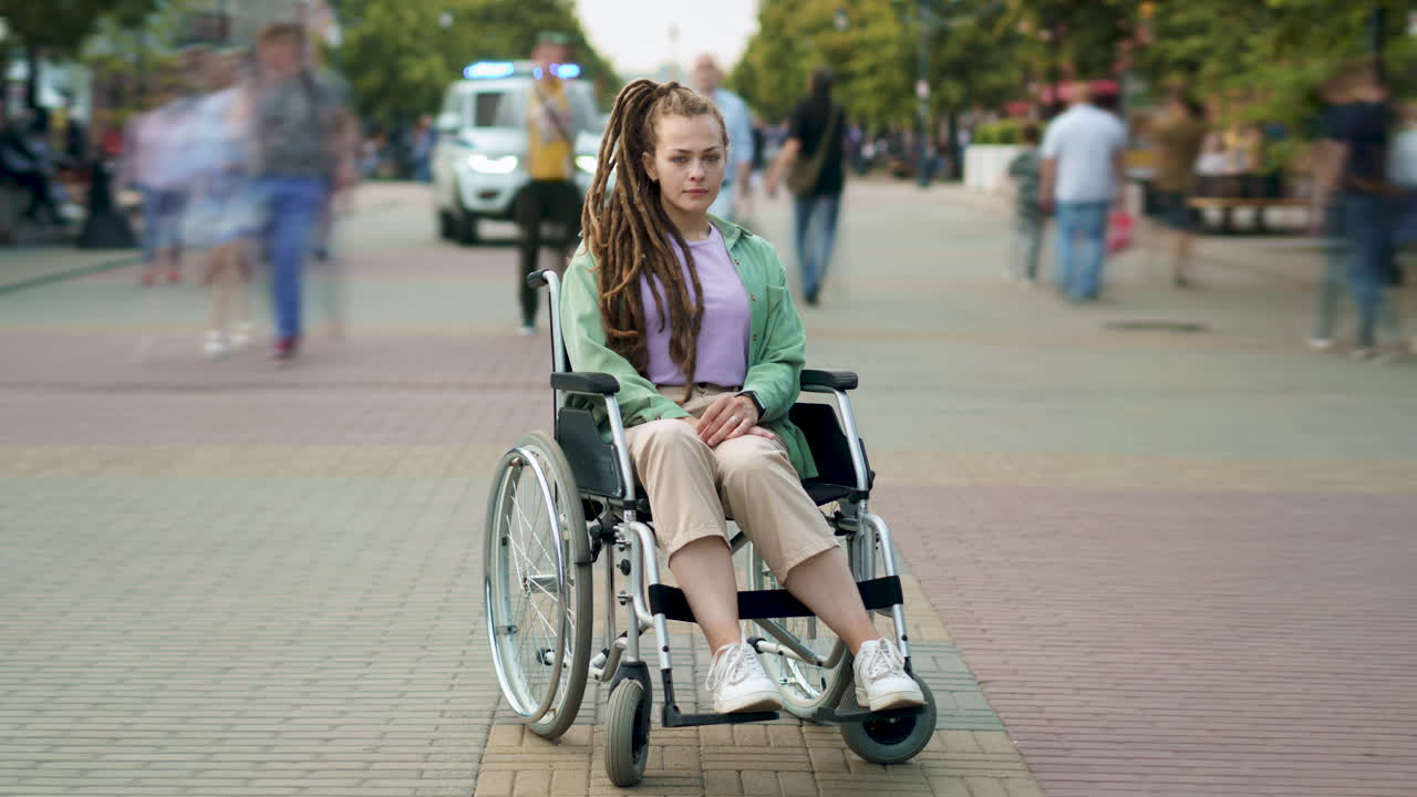 Woman in Wheelchair in City Park
