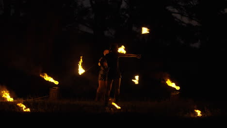 fire jugglers at night