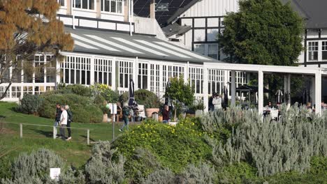 people socializing and relaxing in hotel garden