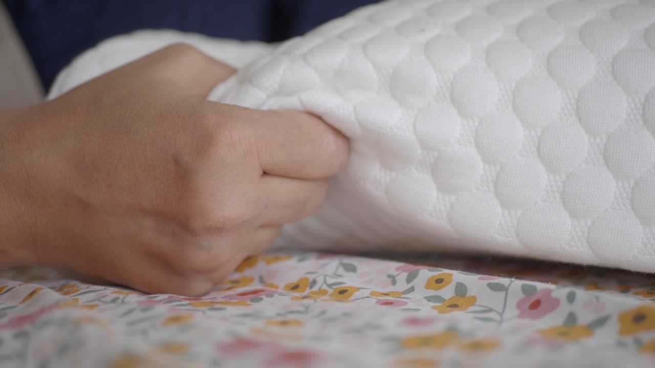 Close up of a white memory foam pillow