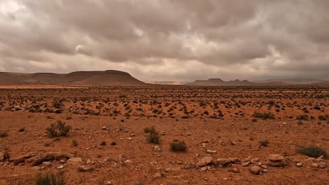 tunisia desert landscape and cloudy dramatic sky seen from car passenger point of view