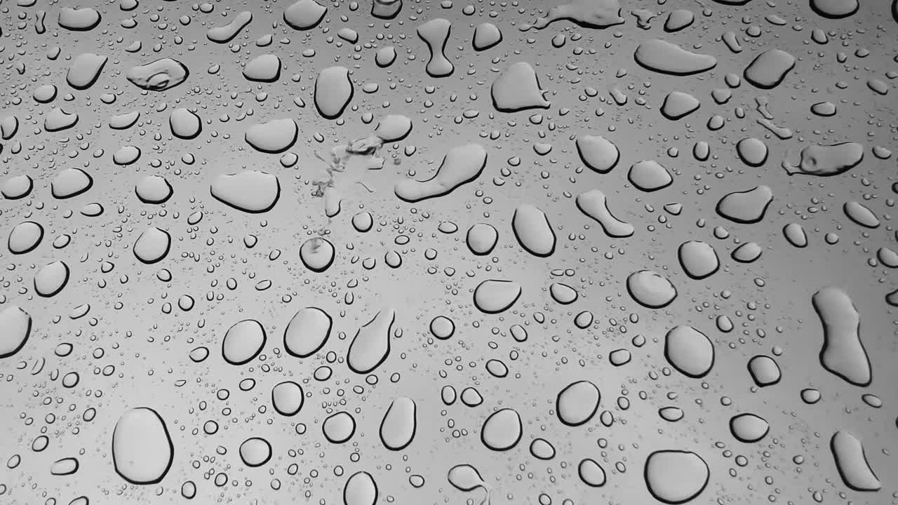 Water Droplets on a Gray Surface