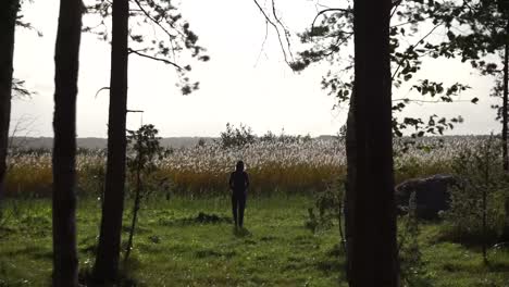 Girl-walking-towards-lake