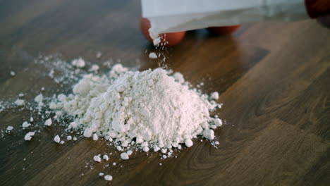 poured flour pile on wooden surface homemade pasta prep