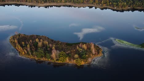 a drone rotates high above an island in a lake at kalmthoutse heide antwerp, belgium