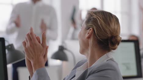 happy business people celebrating successful victory clapping enjoying success in diverse office celebration enjoying teamwork