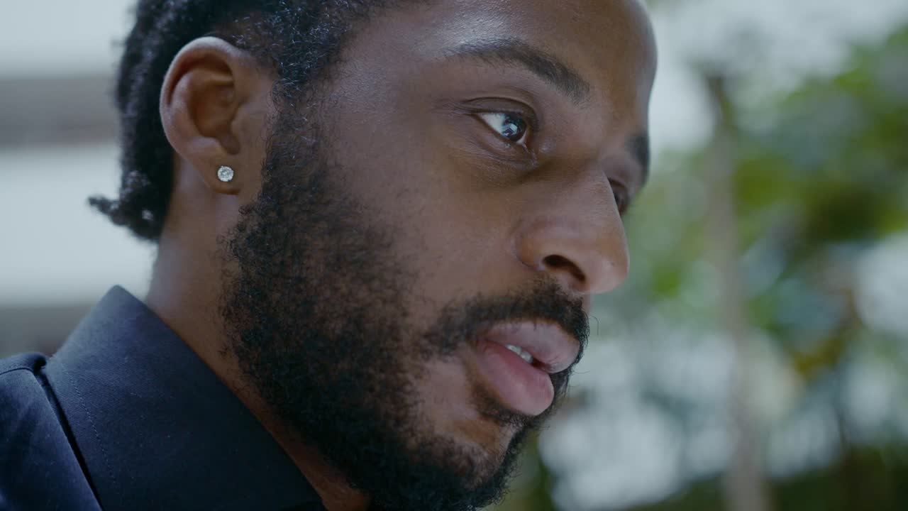 Portrait of a man with a beard and earring