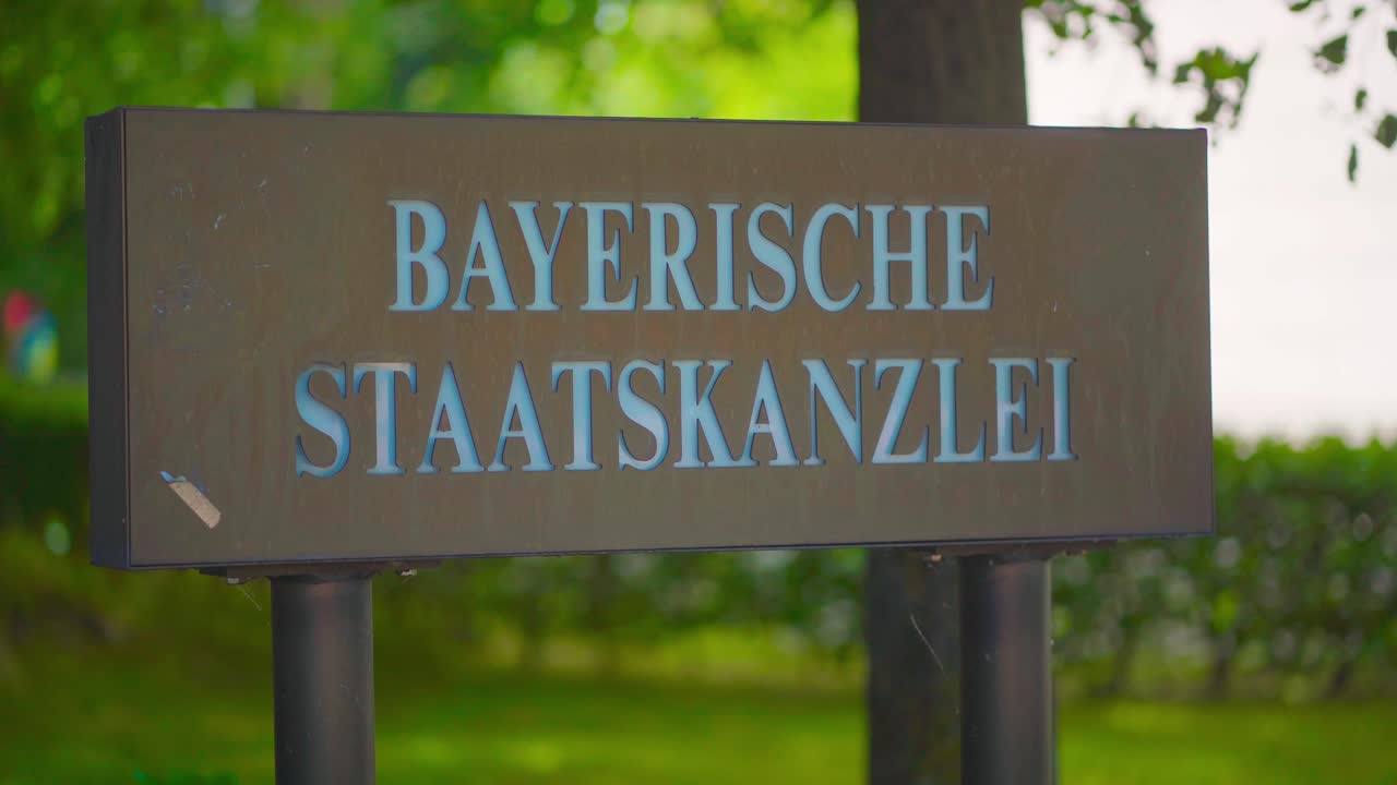 Sign with the inscription "Bayrische Staatskanzlei", which translates as Bavarian State Chancellery. The government building is located in the Bavarian capital Munich