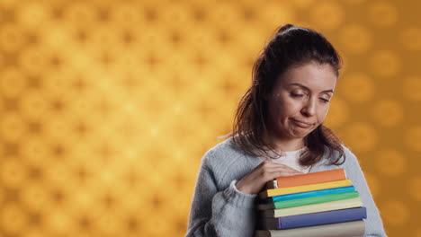 Sulky-lady-with-stack-of-novels-doing-thumbs-down-hand-gesturing