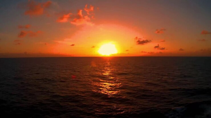 Sundown on the Gulf of Mexico, The smoke from the fires in California have given an ominous orange red glow to the setting sun